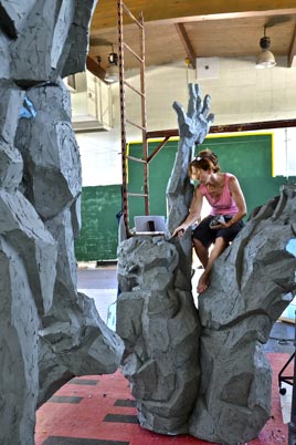 Artist working on bronze sculpture
